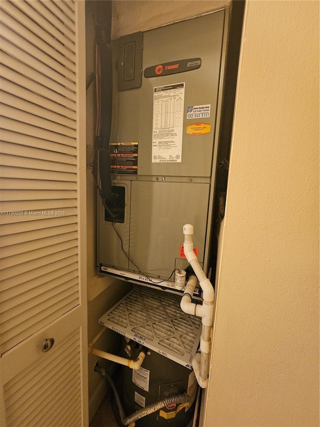 utility room with heating unit