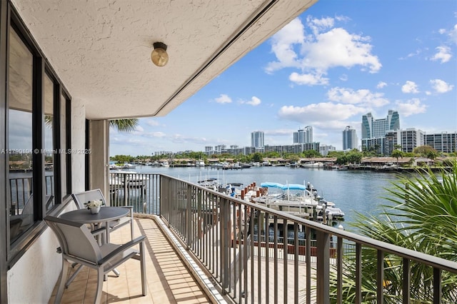 balcony with a city view and a water view