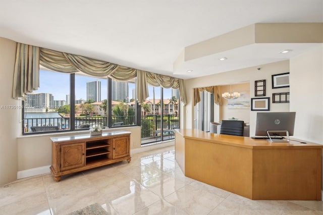 interior space with a city view, baseboards, and a notable chandelier