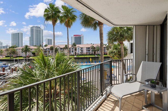 balcony featuring a water view