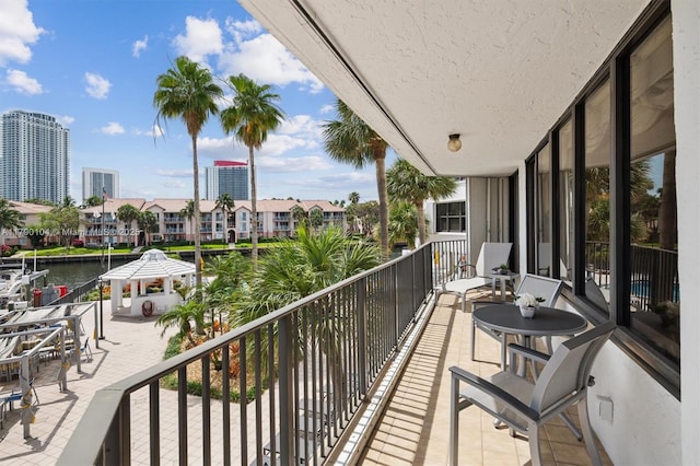 balcony featuring a water view