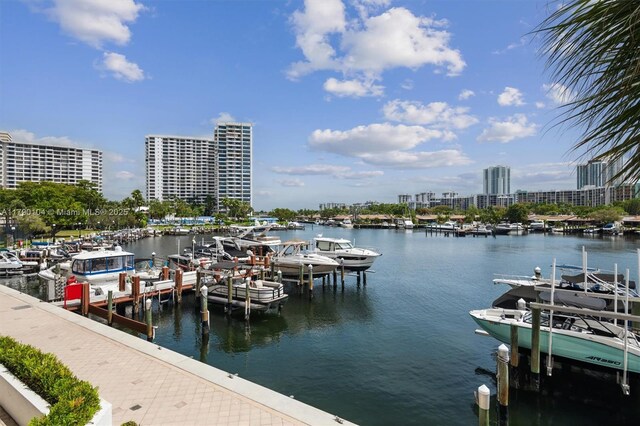 view of dock with a city view and a water view