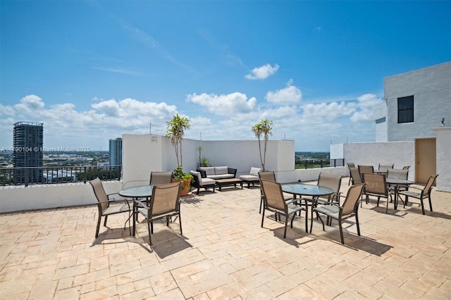 view of patio / terrace featuring outdoor dining space and an outdoor living space