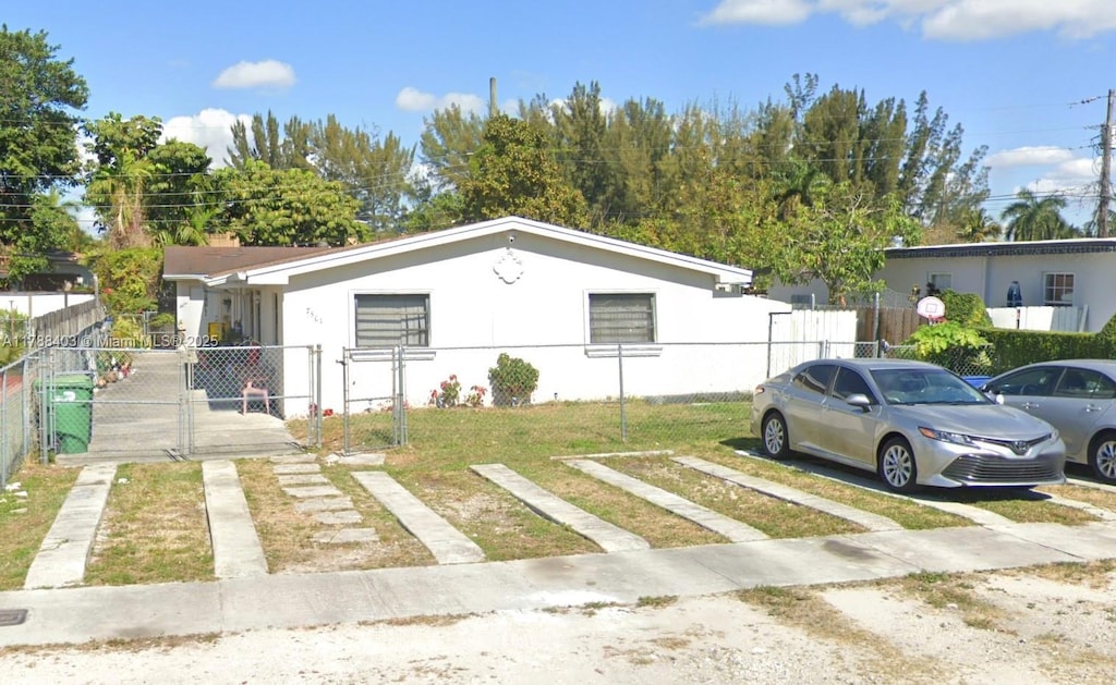7501 NW 2nd Ter, Miami, FL 33126 - single story home with a gate and stucco siding