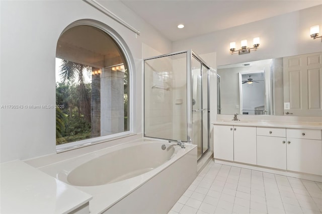 15355 SW 34th St, Davie, FL 33331 - bathroom with vanity, a bath, a shower stall, tile patterned floors, and ceiling fan