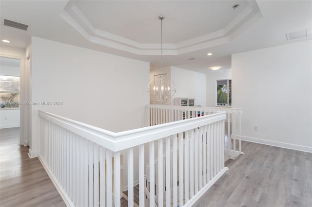15355 SW 34th St, Davie, FL 33331 - hall featuring a tray ceiling, an upstairs landing, wood finished floors, a chandelier, and recessed lighting