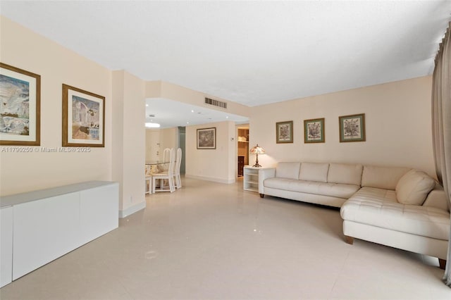 living room with visible vents and baseboards
