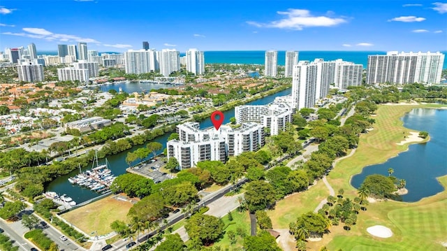 drone / aerial view featuring a water view and a city view