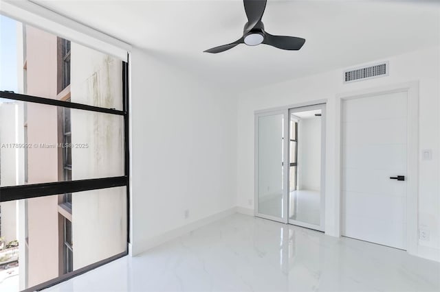 20335 W Country Club Dr Unit 1902, Aventura, FL 33180 - unfurnished bedroom with marble finish floors and a ceiling fan