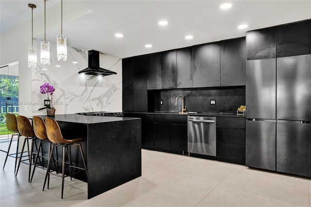 9248 Magnolia Ct, Davie, FL 33328 - kitchen with appliances with stainless steel finishes, dark cabinetry, exhaust hood, dark countertops, and a kitchen breakfast bar