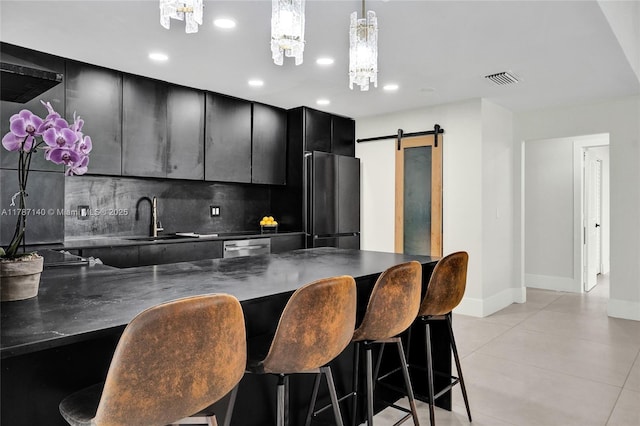 9248 Magnolia Ct, Davie, FL 33328 - kitchen featuring dark cabinets, a sink, dark countertops, fridge, and tasteful backsplash
