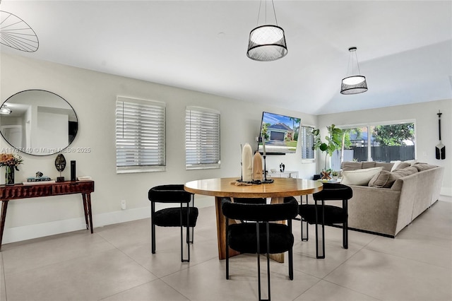 9248 Magnolia Ct, Davie, FL 33328 - dining space with baseboards, lofted ceiling, and light tile patterned floors