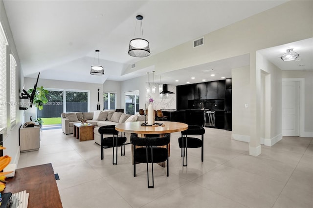 9248 Magnolia Ct, Davie, FL 33328 - dining room featuring lofted ceiling, light tile patterned flooring, and baseboards