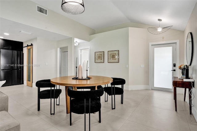 9248 Magnolia Ct, Davie, FL 33328 - dining room with vaulted ceiling, a barn door, baseboards, and light tile patterned flooring