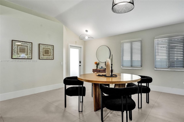 9248 Magnolia Ct, Davie, FL 33328 - dining room featuring light tile patterned floors, baseboards, and lofted ceiling