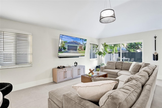9248 Magnolia Ct, Davie, FL 33328 - living room with baseboards, light tile patterned floors, and vaulted ceiling
