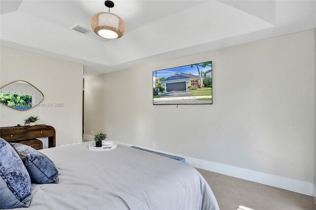 9248 Magnolia Ct, Davie, FL 33328 - bedroom featuring baseboards and a raised ceiling