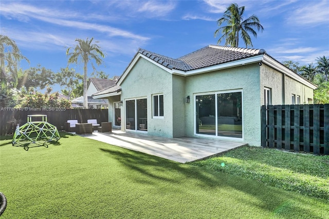 9248 Magnolia Ct, Davie, FL 33328 - back of property featuring stucco siding, a patio, and a tiled roof