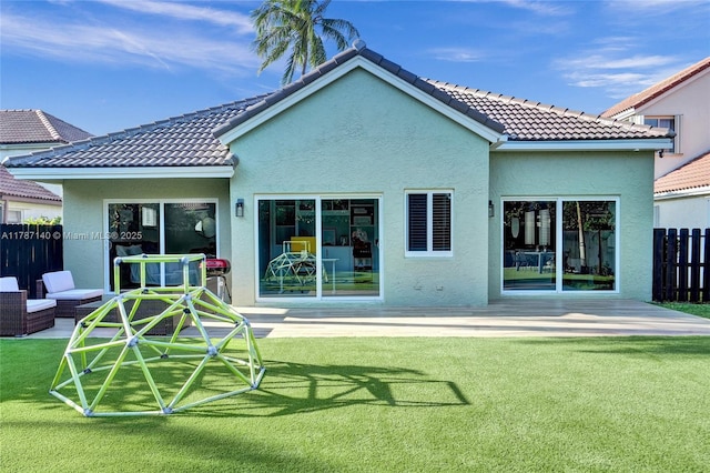 9248 Magnolia Ct, Davie, FL 33328 - rear view of property with stucco siding, a tiled roof, and a patio