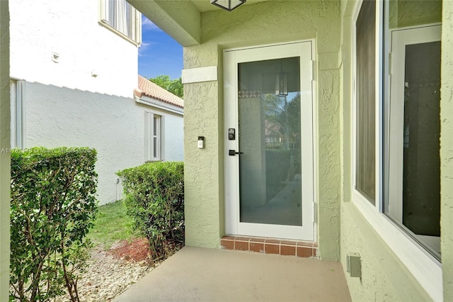9248 Magnolia Ct, Davie, FL 33328 - view of exterior entry featuring stucco siding