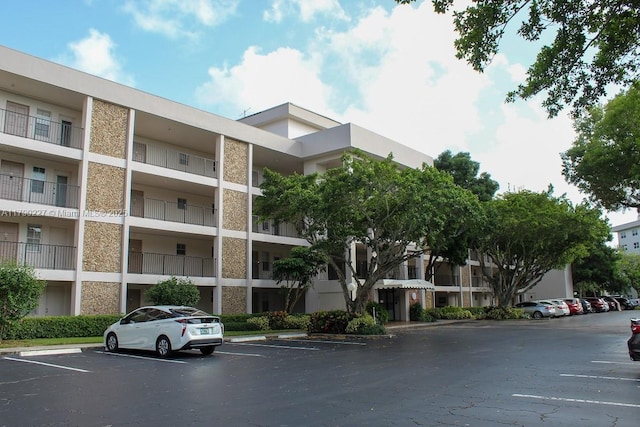 view of property with uncovered parking
