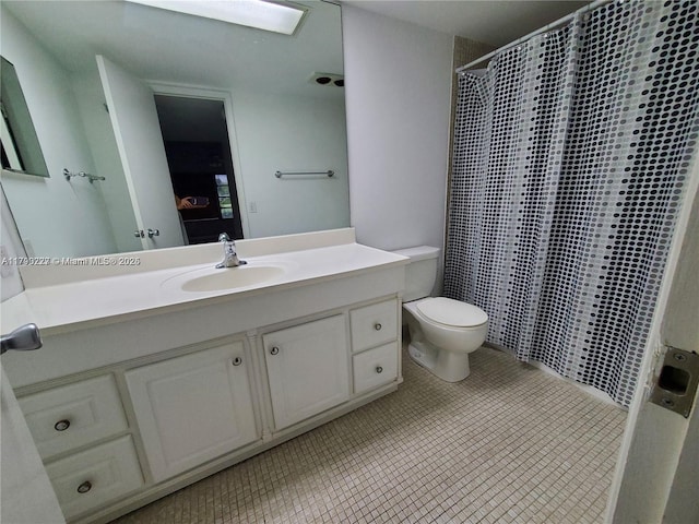 bathroom featuring vanity, toilet, a shower with curtain, and tile patterned flooring