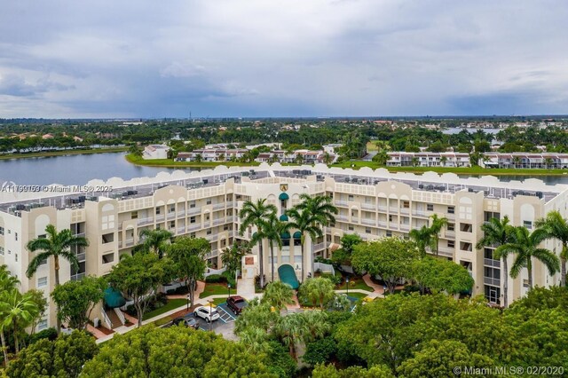10730 NW 66 Unit 101, Doral, FL 33178 - drone / aerial view of a nearby body of water and apartment complex / building