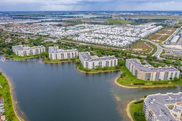 10730 NW 66 Unit 101, Doral, FL 33178 - drone / aerial view of a large body of water and apartment complex