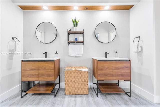 10730 NW 66 Unit 101, Doral, FL 33178 - full bathroom with baseboards, wood finished floors, and two vanities