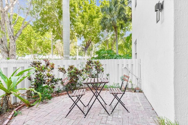 10730 NW 66 Unit 101, Doral, FL 33178 - view of patio featuring a fenced backyard