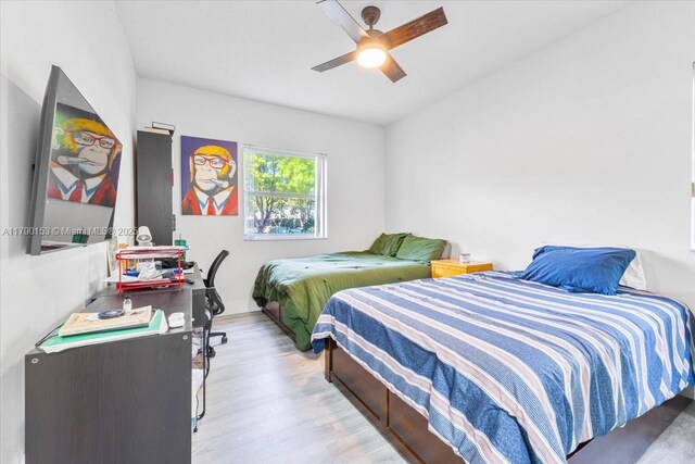 10730 NW 66 Unit 101, Doral, FL 33178 - bedroom with wood finished floors and ceiling fan