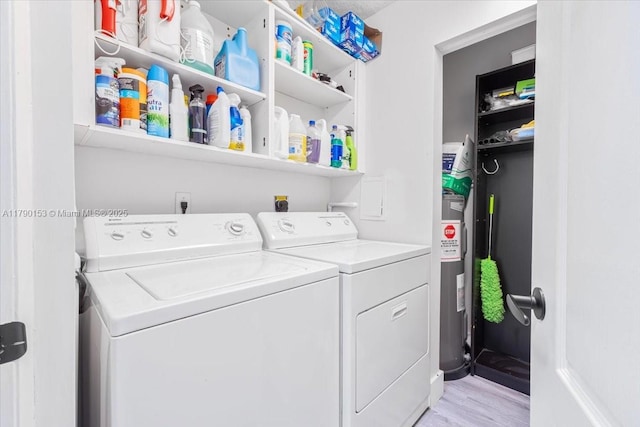 10730 NW 66 Unit 101, Doral, FL 33178 - laundry area featuring separate washer and dryer, light wood-type flooring, and water heater
