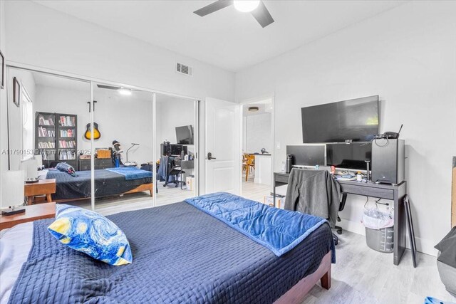 10730 NW 66 Unit 101, Doral, FL 33178 - bedroom with an office area, wood finished floors, a closet, and ceiling fan