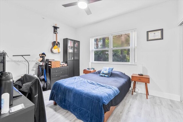 10730 NW 66 Unit 101, Doral, FL 33178 - bedroom with wood finished floors, a ceiling fan, and baseboards