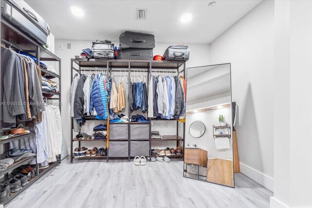 10730 NW 66 Unit 101, Doral, FL 33178 - walk in closet featuring wood finished floors