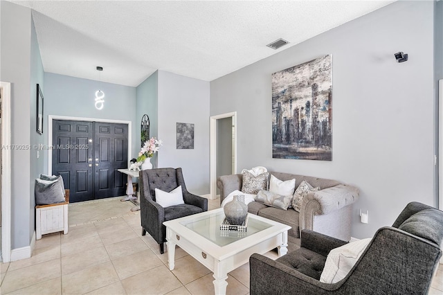 13995 S Cypress Cove Cir, Davie, FL 33325 - living area with light tile patterned flooring and a textured ceiling