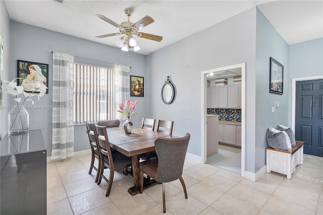 13995 S Cypress Cove Cir, Davie, FL 33325 - dining area with ceiling fan, light tile patterned floors, and a textured ceiling