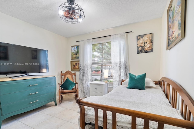 13995 S Cypress Cove Cir, Davie, FL 33325 - bedroom featuring light tile patterned floors and a textured ceiling