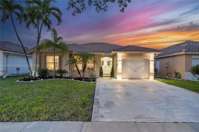 13995 S Cypress Cove Cir, Davie, FL 33325 - mediterranean / spanish-style house featuring a tiled roof, an attached garage, concrete driveway, stucco siding, and a front lawn