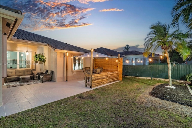 13995 S Cypress Cove Cir, Davie, FL 33325 - yard at dusk with an outdoor living space and a patio area