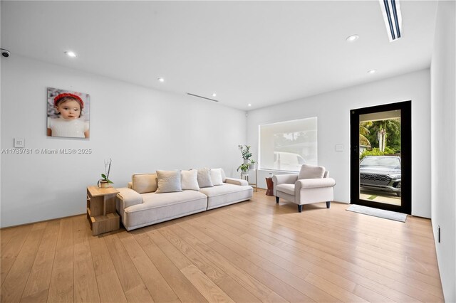 288 NE 117th St, Miami, FL 33161 - living area featuring light wood-style flooring and recessed lighting