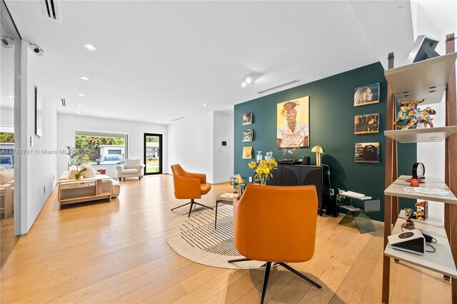 288 NE 117th St, Miami, FL 33161 - living room featuring light wood-type flooring and recessed lighting