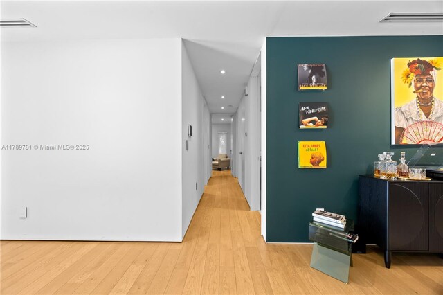 288 NE 117th St, Miami, FL 33161 - corridor featuring light wood-style flooring and recessed lighting