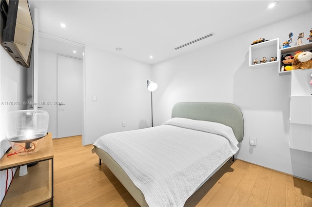 288 NE 117th St, Miami, FL 33161 - bedroom with light wood finished floors and recessed lighting