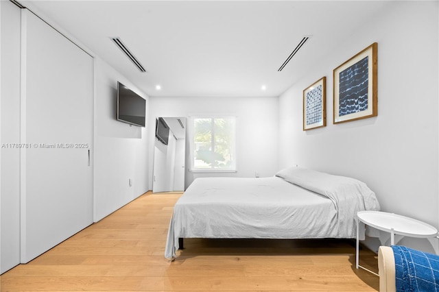 288 NE 117th St, Miami, FL 33161 - bedroom featuring light wood-type flooring and recessed lighting