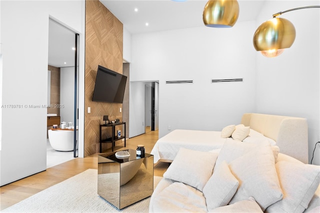 bedroom with light wood-type flooring and recessed lighting