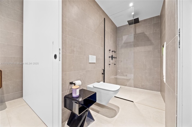 bathroom with tile walls, tile patterned floors, walk in shower, and toilet