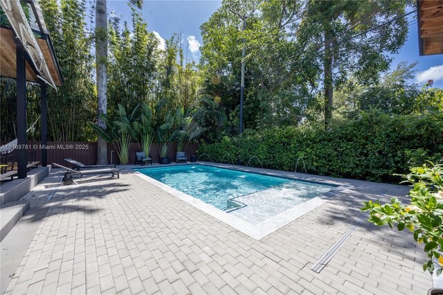 288 NE 117th St, Miami, FL 33161 - view of swimming pool with a patio