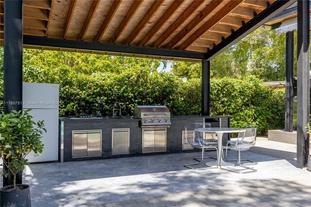 288 NE 117th St, Miami, FL 33161 - view of patio / terrace featuring area for grilling and outdoor dining space