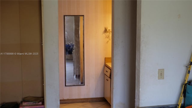 hallway with light tile patterned floors